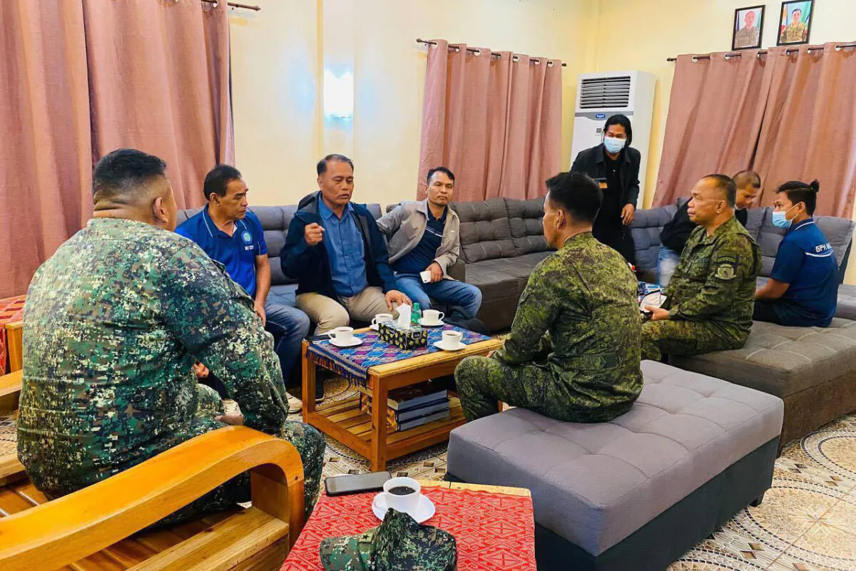 Western Mindanao Command, Government Peace Implementing Panel Chair David B. Diciano (C) talks with WESMINCOM acting commander Brig. Gen. Arturo Rojas (L) and Brig. Gen. Eduardo Gubat, acting commander of the Philippine Army's (PA) 6th Infantry Division, and rebel mediators during emergency talks to discuss a ceasefire at southern Basilan province, Philippines, on Nov. 10, 2022. (Public Information Office, Western Mindanao Command via AP)