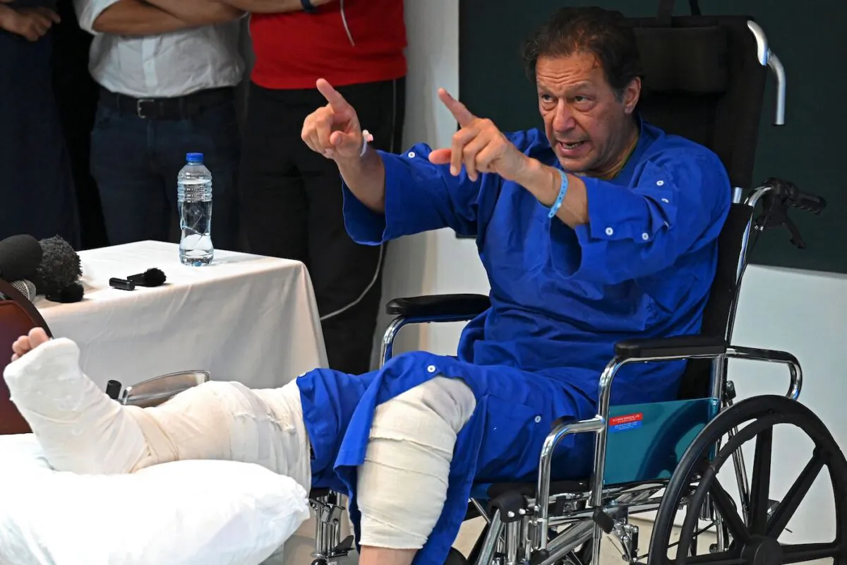 Pakistan's former prime minister Imran Khan addresses the media representatives at a hospital in Lahore on Nov. 4, 2022, a day after an assassination attempt on him. (Arif Ali/AFP via Getty Images)