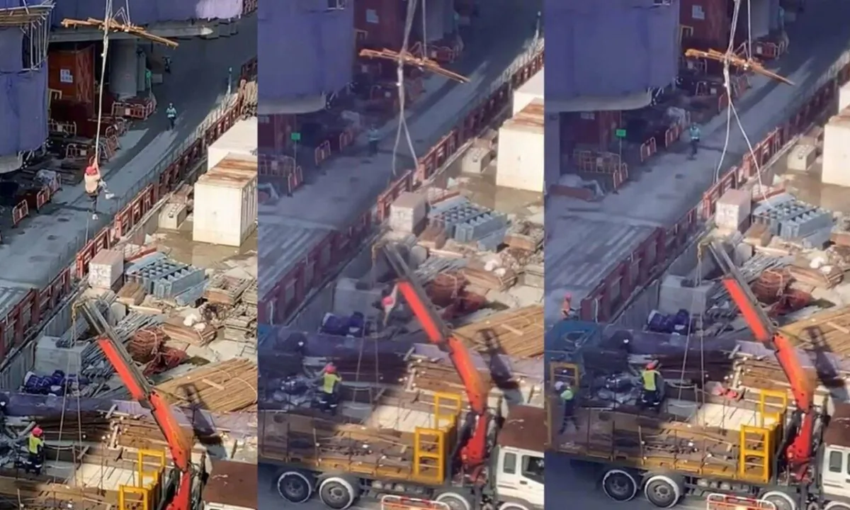 A worker was entangled by the tail rope of a tower crane and lifted into the air. He lost his grasp on the rope as he was being lowered to the ground, and he fell. (Screenshot of the video courtesy by Onba Lee)