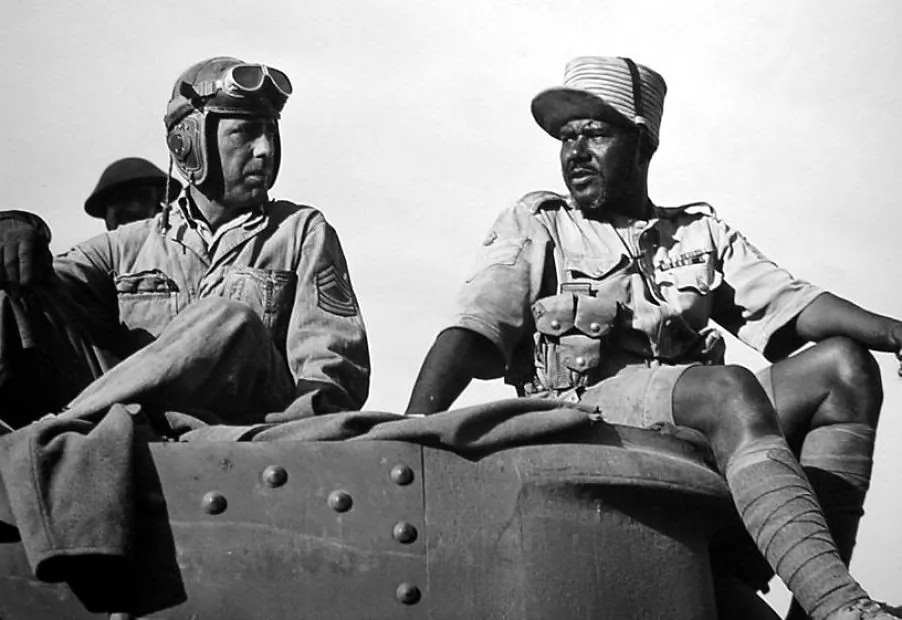 Sgt. Joe Gunn (Humphrey Bogart, L) and Sgt. Maj.Tambul (Rex Ingram) in “Sahara.” (Columbia Pictures)