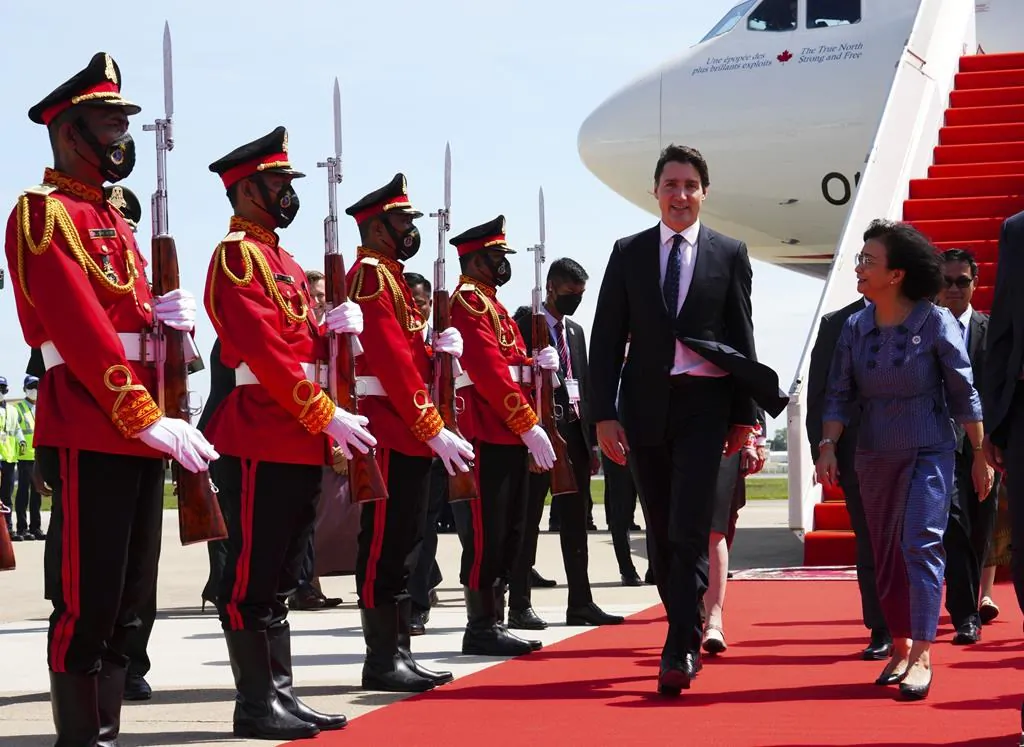 Prime Minister Justin Trudeau is greeted by Cambodia's Minister of Women's Affairs Ing Kantha Phavi as he arrives in Phnom Penh, Cambodia, on Nov. 12, 2022, to attend the ASEAN Summit. (The Canadian Press/Sean Kilpatrick)