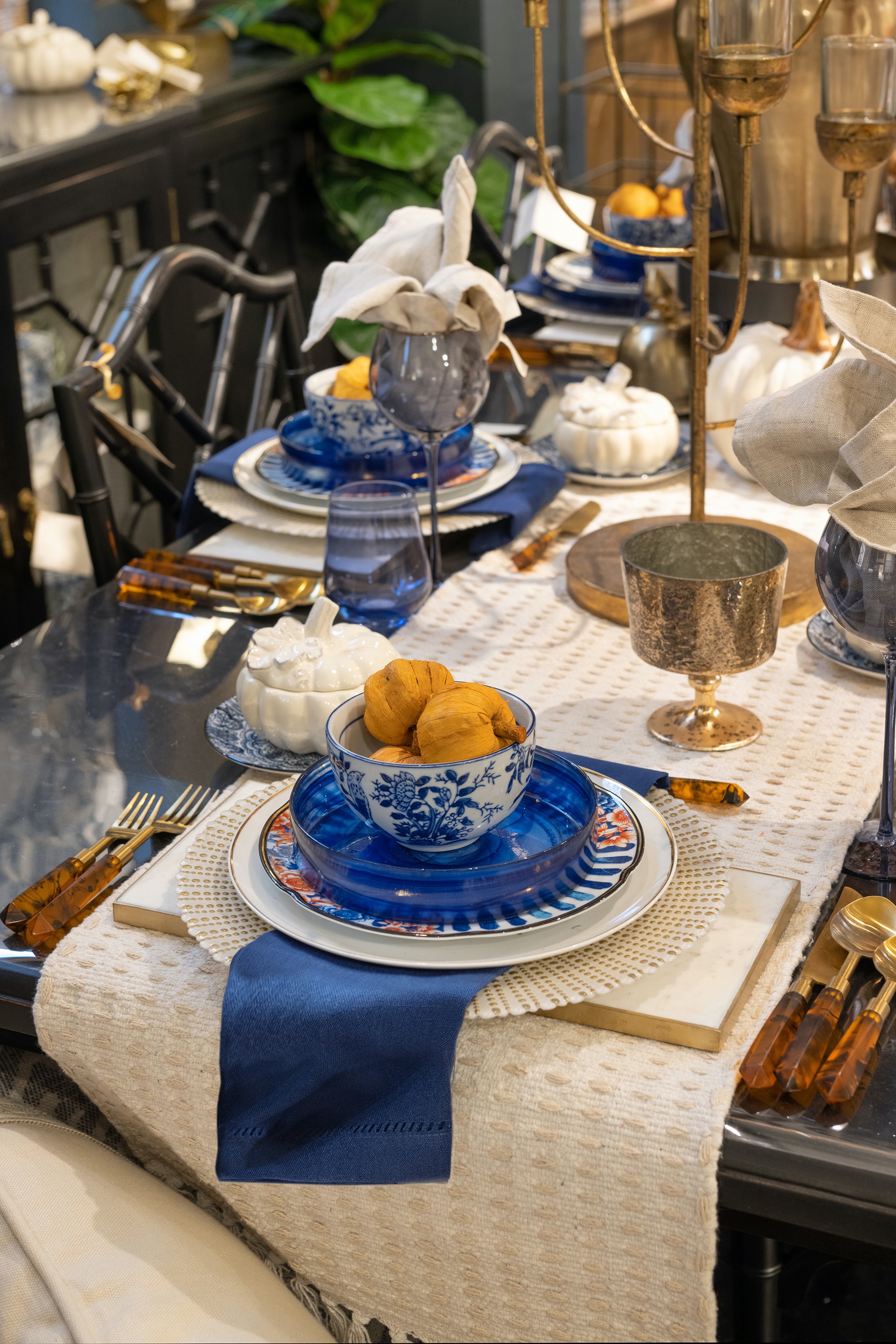 Blue and white chinoiserie is an unexpected juxtaposition to the bright orange pumpkins of the season.