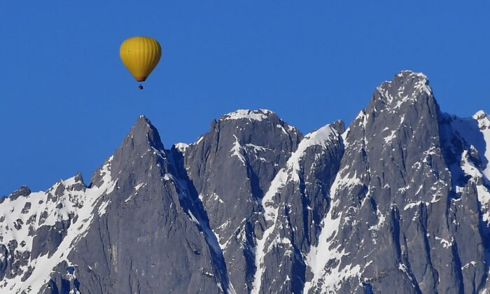 Hot air balloons flying over the Tyrolean Alps near Kitzbuhel, Austria, January 15, 2018.  (Joe Klamar/AFP via Getty Images)