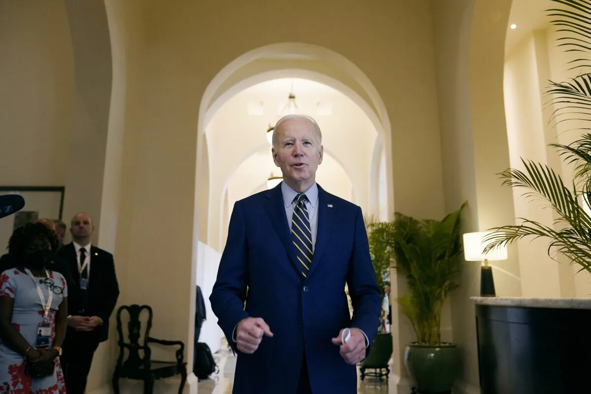 President Joe Biden smiles as he speaks about democratic control of the Senate before leaving his hotel to attend the Association of Southeast Asian Nations (ASEAN) summit in Phnom Penh, Cambodia, on Nov. 13, 2022. (Alex Brandon/AP Photo)