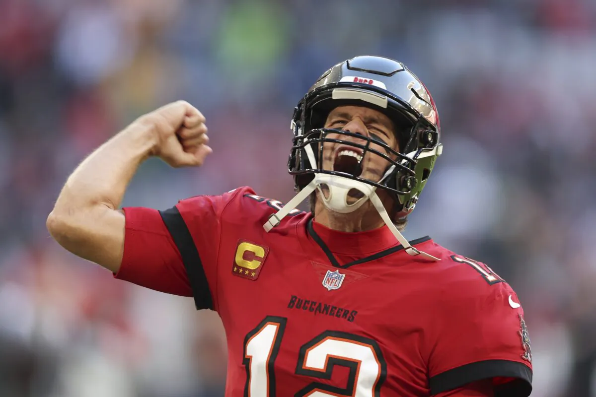 Tampa Bay Buccaneers quarterback Tom Brady runs onto the field before an NFL football game against the Seattle Seahawks in Munich on Nov. 13, 2022. (Gary McCullough/AP Photo)