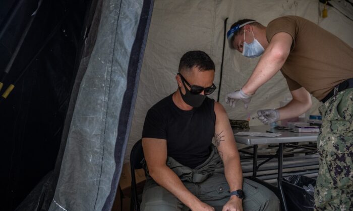 A member of the U.S. military receives the Moderna coronavirus vaccine at Camp Foster on April 28, 2021 in Ginowan, Japan. (Carl Court/Getty Images)