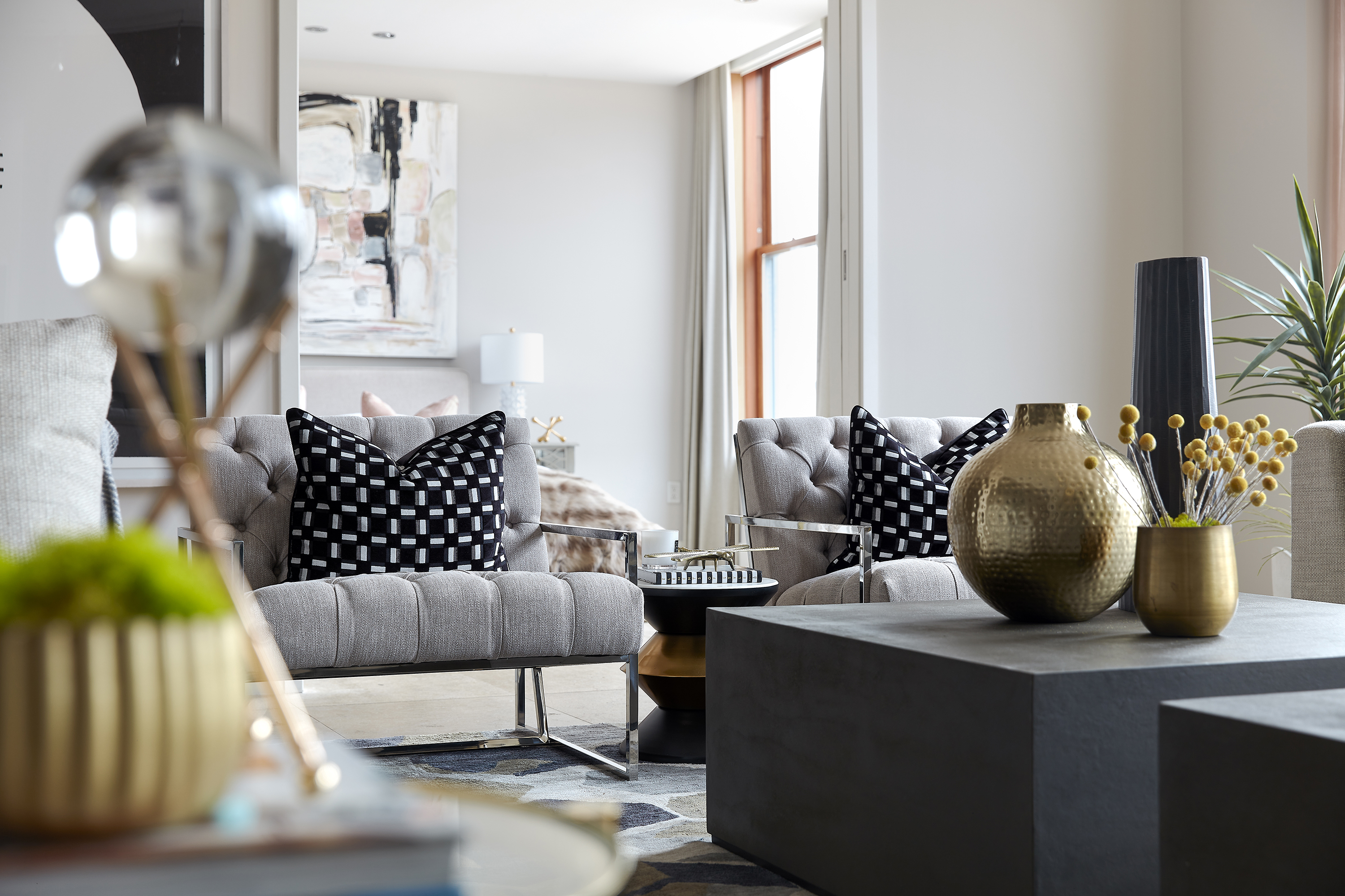 An abundance of black and white accessories adds a sense of luxury and richness to this living space.