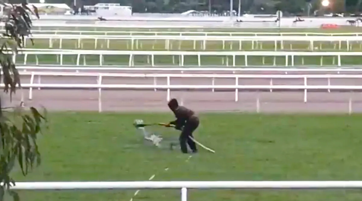 Vandal dumps 'oily sludge' on Flemington ahead of Melbourne Cup, an iconic event that stops the nation. (Supplied by Extinction Rebellion)