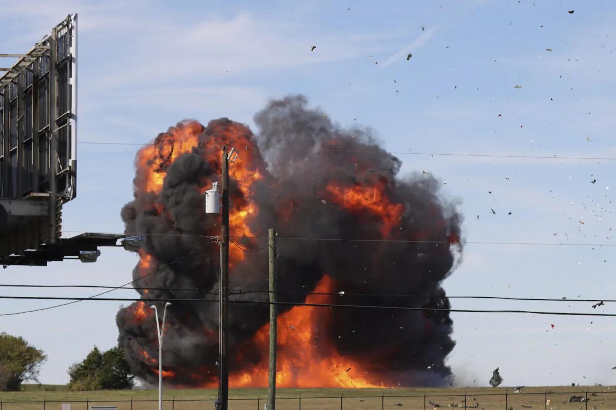 A historic military plane crashes after colliding with another plane during an airshow at Dallas Executive Airport in Dallas, Texas, on Nov. 12, 2022. (Nathaniel Ross Photography via AP)