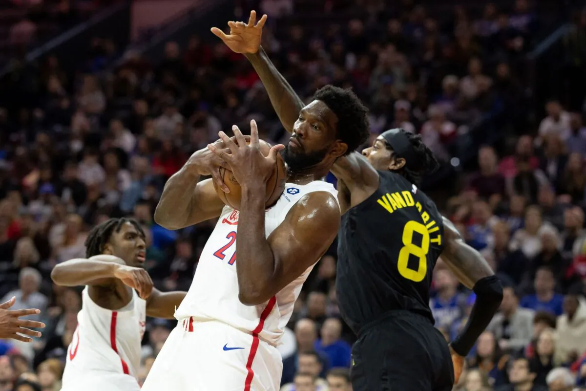 Philadelphia 76ers center Joel Embiid (21) rebounds the ball in front of Utah Jazz forward Jarred Vanderbilt (8) during the third quarter at Wells Fargo Center in Philadelphia on Nov. 13, 2022. (Bill Streicher/USA TODAY Sports via Field Level Media)