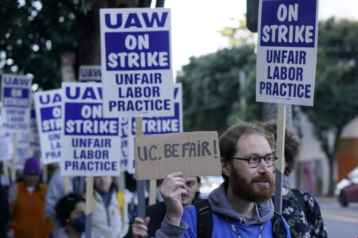 People take part in a protest outside of the University of California San Francisco medical offices in San Francisco, Nov. 14, 2022. Nearly 48,000 unionized academic workers at all 10 University of California campuses have walked off the job Monday. (Jeff Chiu/AP Photo)
