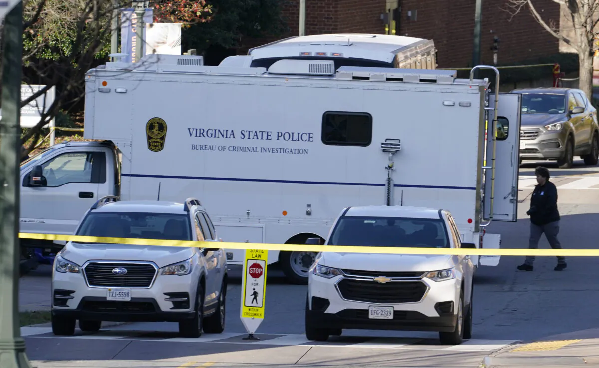 A Virginia State Police crime scene investigation truck is on the scene of an overnight shooting at the University of Virginia in Charlottesville, Va., on Nov. 14, 2022. (AP Photo/Steve Helber)