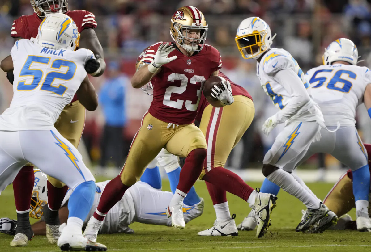 Christian McCaffrey (23) of the San Francisco 49ers rushes during the third quarter against the Los Angeles Chargers at Levi's Stadium in Santa Clara, Calif., on Nov. 13, 2022. (Thearon W. Henderson/Getty Images)