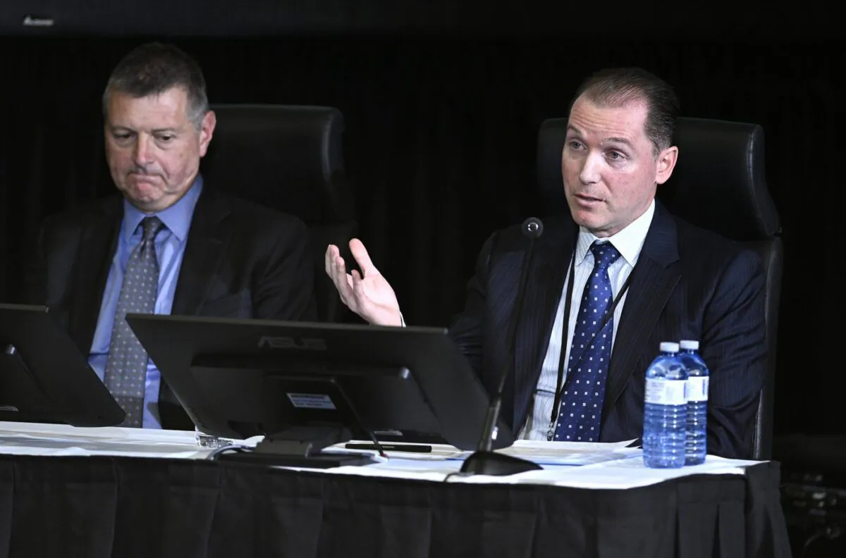 Rob Stewart, Deputy Minister of Public Safety, left, and Dominic Rochon, Senior Assistant Deputy Minister, National and Cybersecurity Branch at Public Safety Canada, appear at the Public Order Emergency Commission, in Ottawa, on Nov. 14, 2022. (The Canadian Press/Justin Tang)
