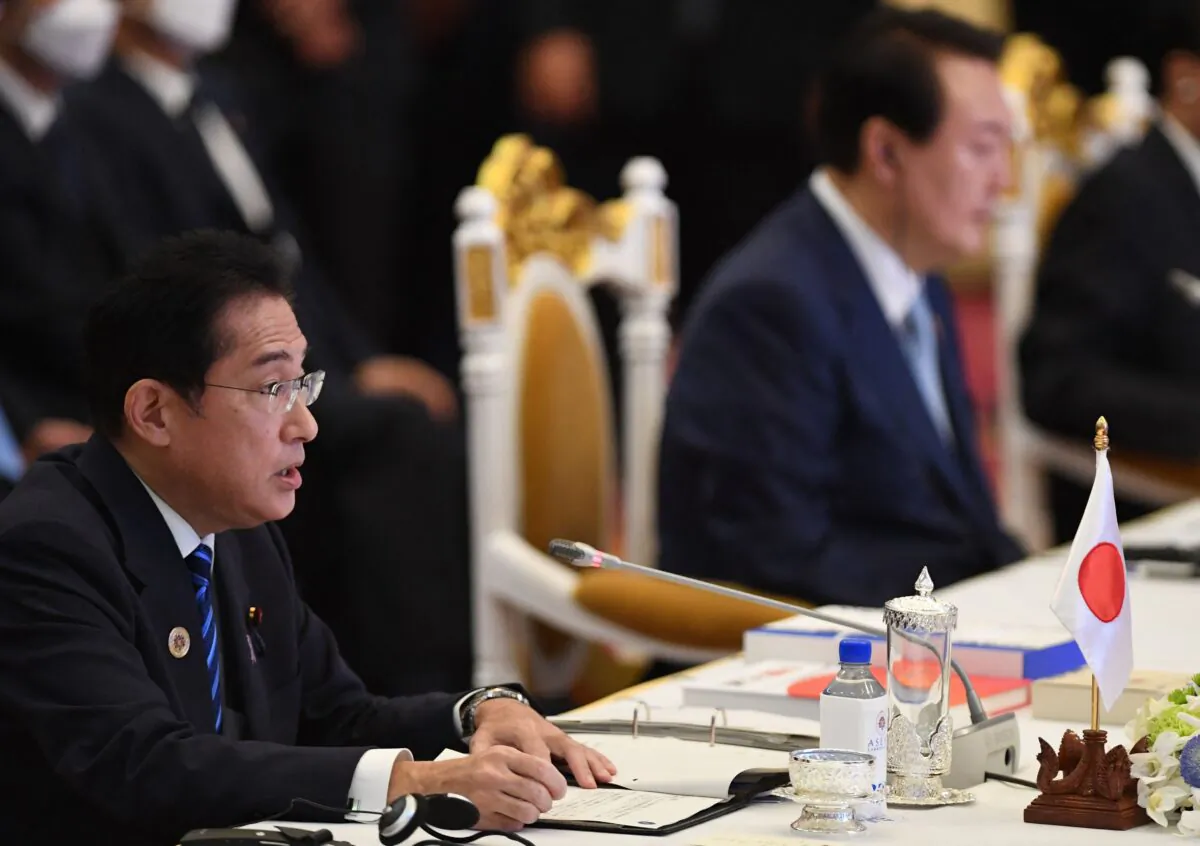Japan's Prime Minister Fumio Kishida (L) and South Korea's President Yoon Suk-yeol (R) take part in the ASEAN-Plus Three Summit as part of the 40th and 41st Association of Southeast Asian Nations (ASEAN) Summits in Phnom Penh on Nov. 12, 2022. (TANG CHHIN SOTHY/AFP via Getty Images)