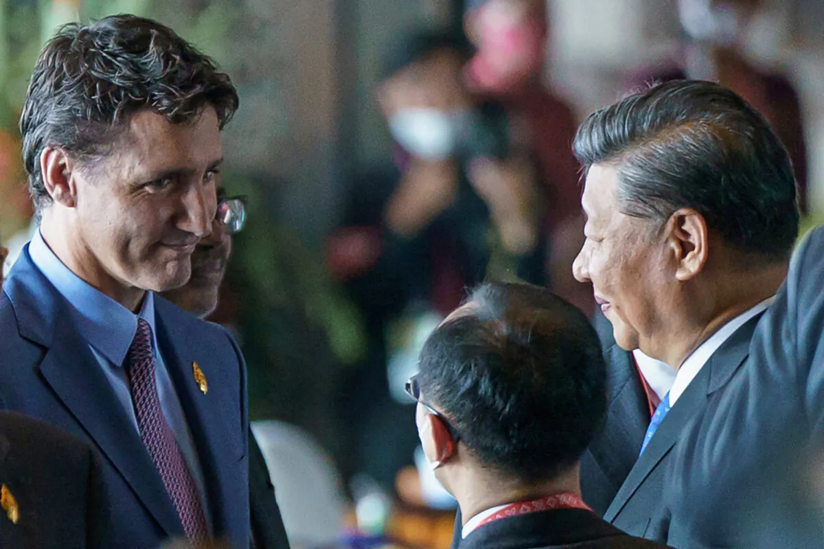 Prime Minister Justin Trudeau speaks with Chinese Leader Xi Jinping at the G20 Leaders' Summit in Bali, Indonesia, Nov. 15, 2022. (Adam Scotti/Prime Minister's Office/Handout via REUTERS)