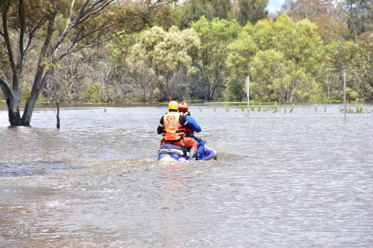 SES members take a jet ski out to assess a job in the floodwaters in Forbes, Australia, on Nov. 6, 2022. (AAP Image/Lucy Cambourn)