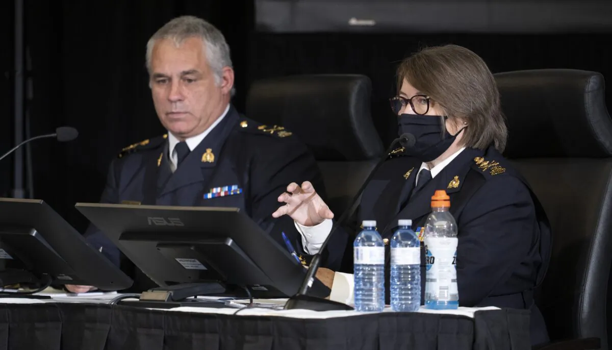 RCMP Deputy Commissioner Mike Duheme looks on as Commissioner Brenda Lucki responds to a question as they appear as witnesses at the Public Order Emergency Commission in Ottawa on Nov. 15, 2022. (Adrian Wyld/The Canadian Press)