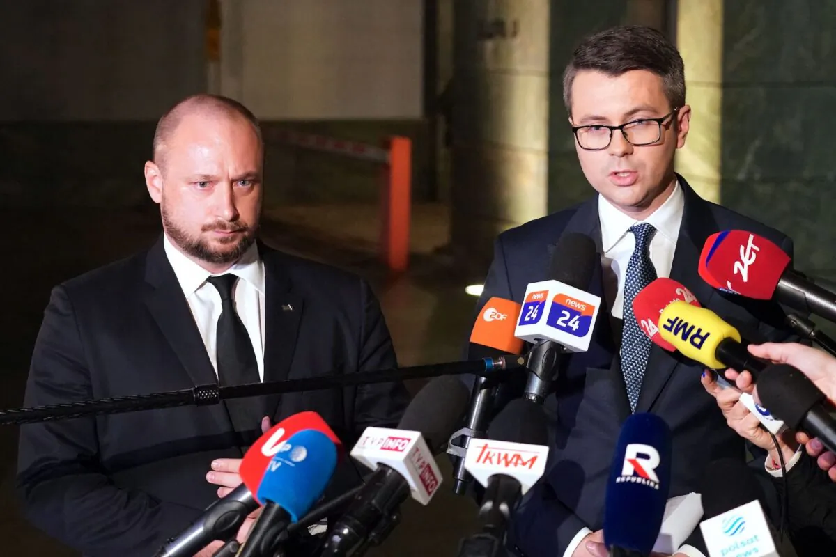 Head of the Office of National Security, Jacek Siewiera (L), and Spokesperson of the Polish government, Piotr Muller, make a statement after a crisis meeting of the Office of National Security, in Warsaw, on Nov. 15, 2022. (Janek Skarzynski/AFP via Getty Images)