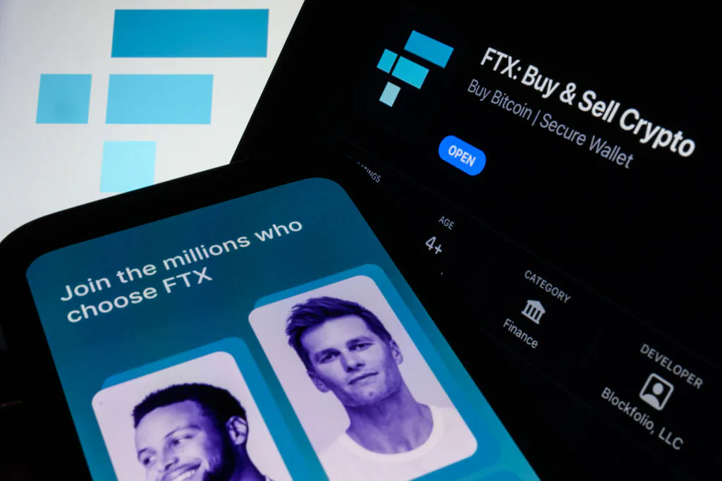 The FTX logo and mobile app adverts are displayed on screens in London, England, on Nov. 10, 2022. (Leon Neal/Getty Images)
