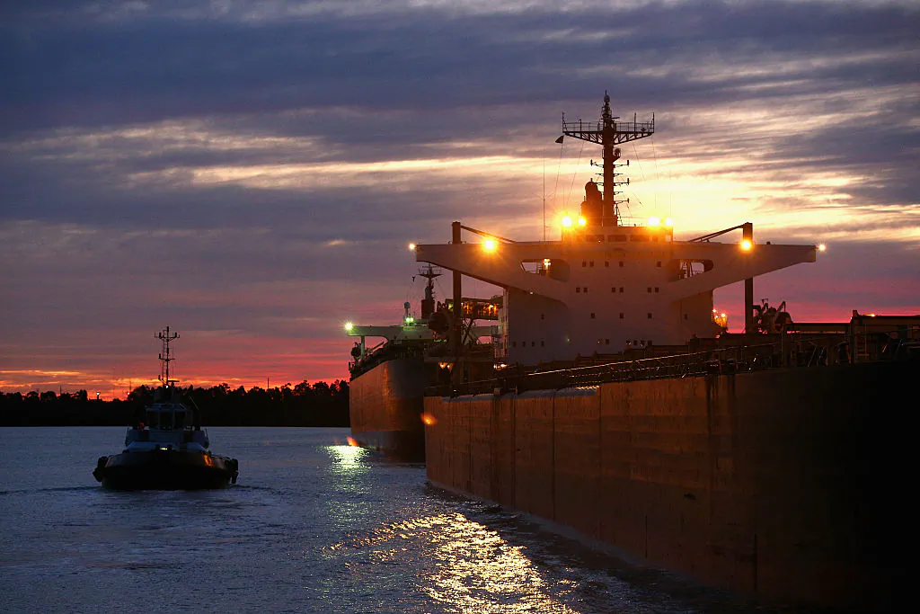 Tugboats assist the 'Oriental Treasure' bulk carrier ship through Newcastle Port in Newcastle, Australia, on July 30, 2015. (Cameron Spencer/Getty Images)