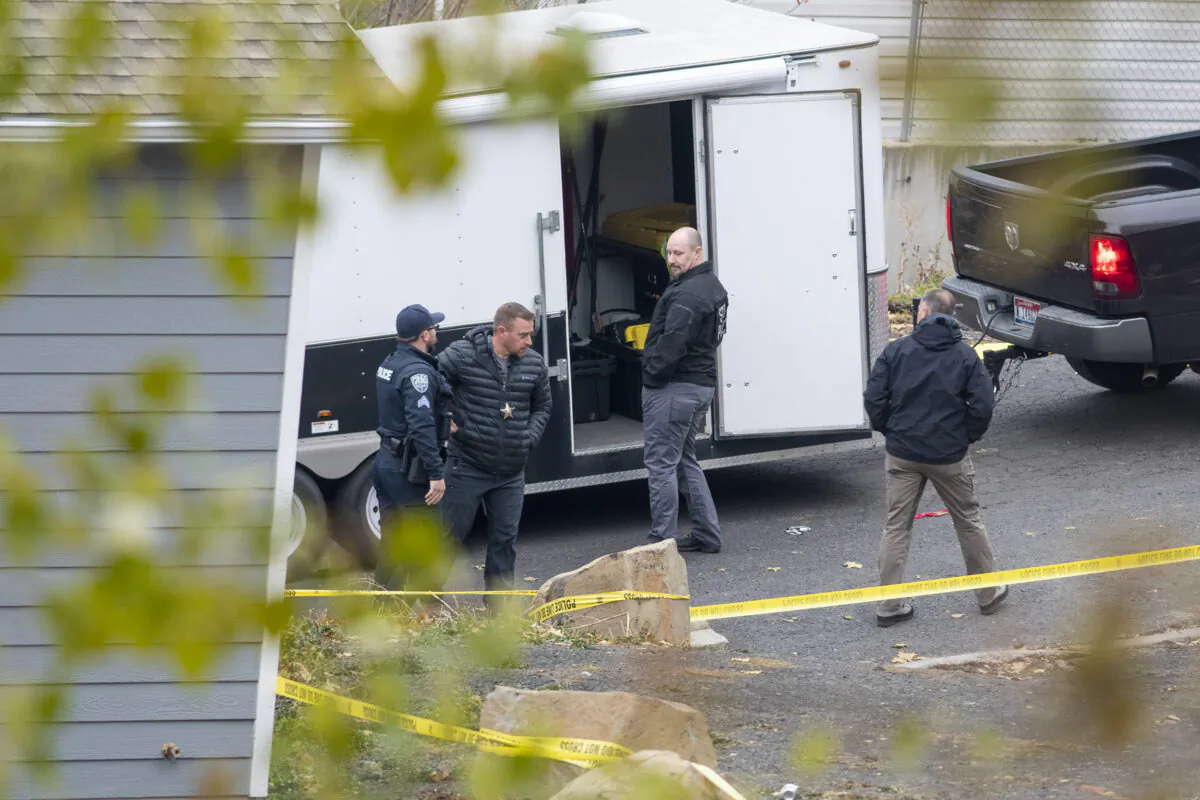 Officers investigate a homicide at an apartment complex south of the University of Idaho campus on Nov. 13, 2022. (Zach Wilkinson/Moscow-Pullman Daily News via AP)