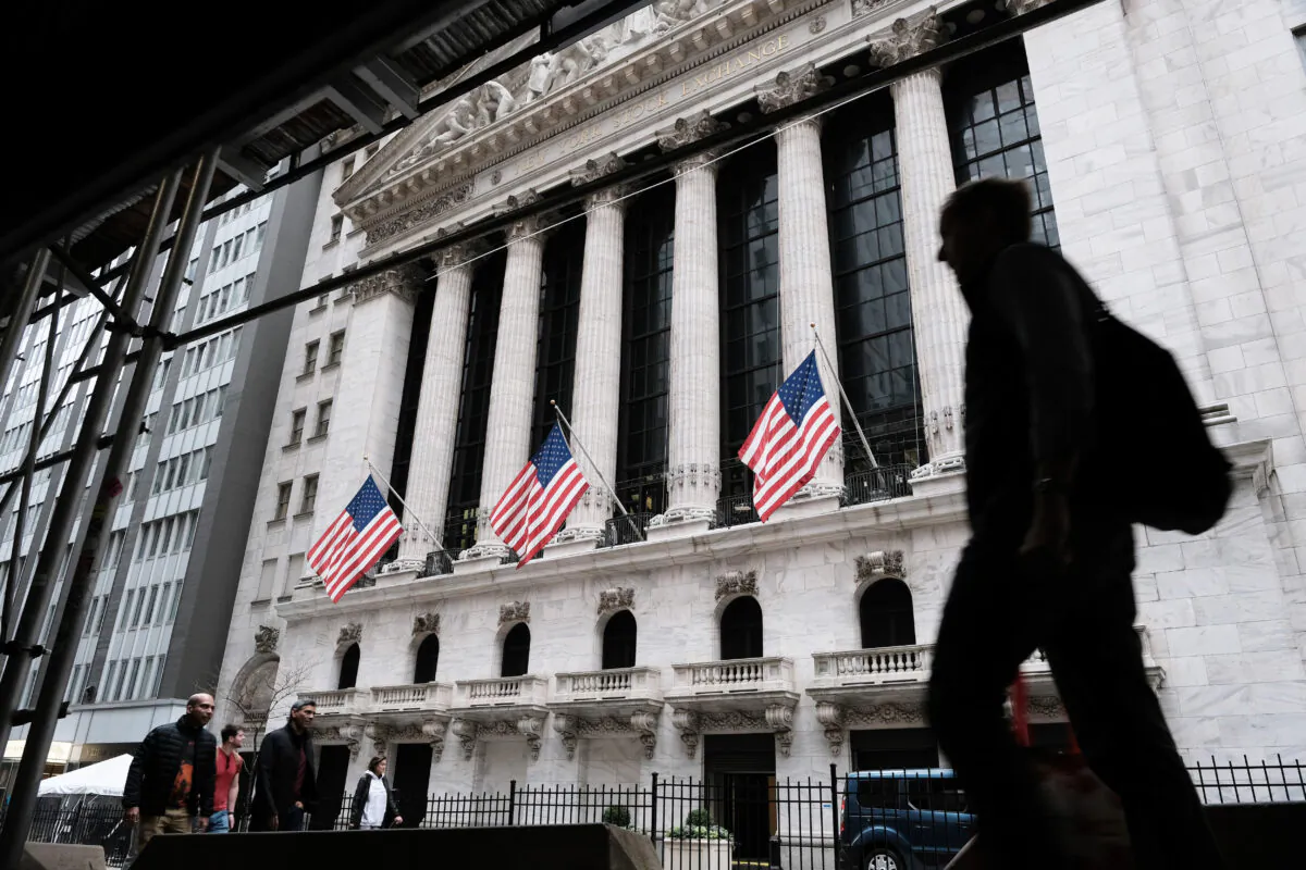 People walk by the New York Stock Exchange in New York City, on Nov. 11, 2022. (Spencer Platt/Getty Images)