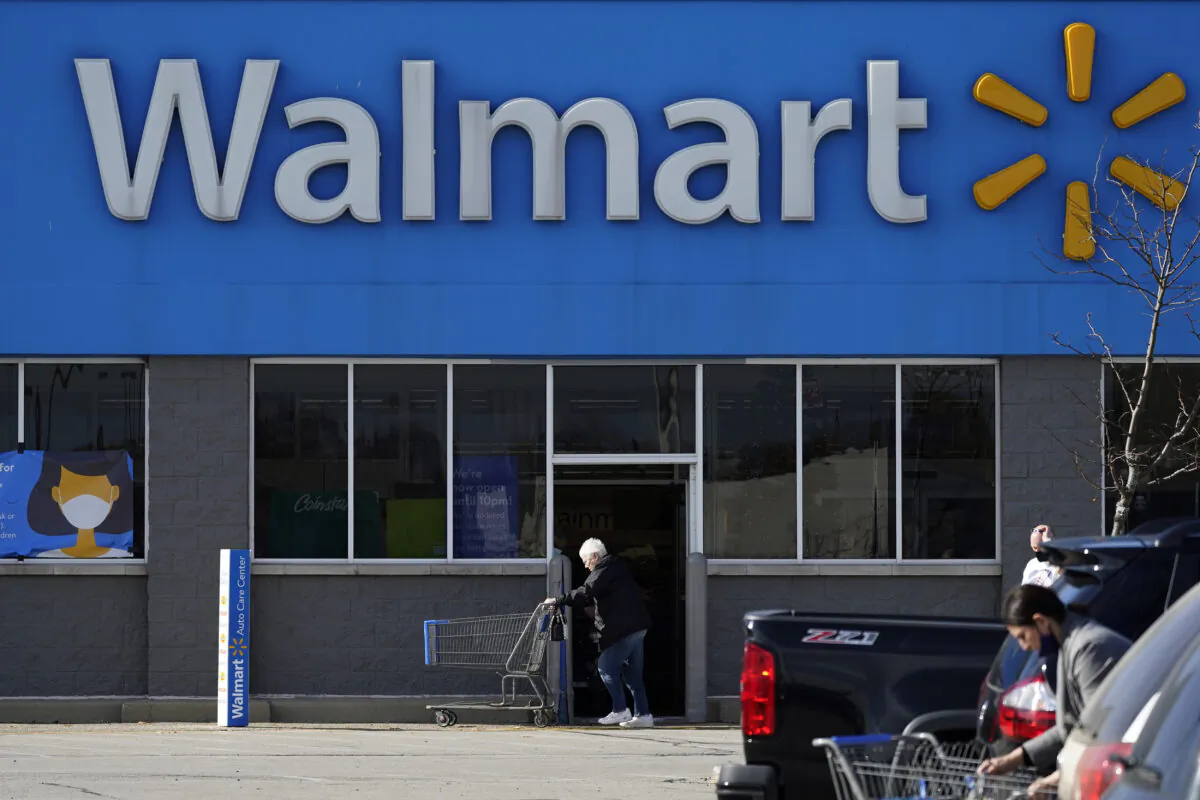 A woman pushes a shopping cart to enter a Walmart in Rolling Meadows, Ill., on Nov. 5, 2020. (Nam Y. Huh/AP Photo/File Photo)
