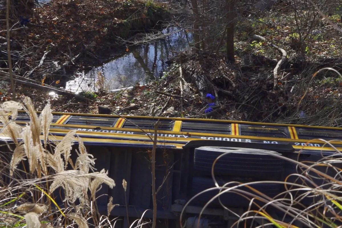 A school bus after crashing over an embankment near near Salyersville, Ky., on Nov. 14, 2022. (WYMT-TV via AP)