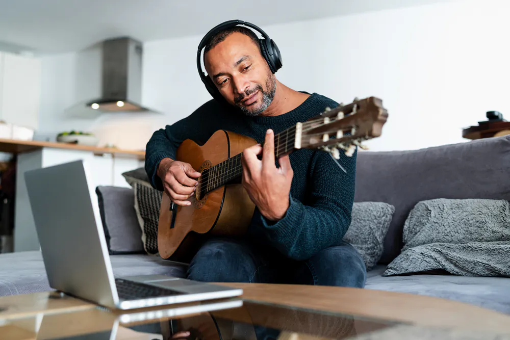 According to author Michael Warren Davis, people can live more fully through activities such as learning a musical instrument, reading, or gardening. (SYC PROD/Shutterstock)