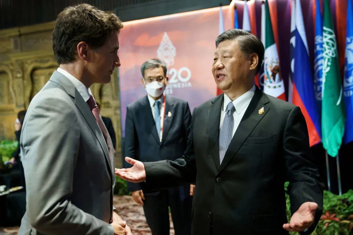 Chinese leader Xi Jinping speaks with Canadian Prime Minister Justin Trudeau on the sidelines of the G-20 summit in Bali, Indonesia, on Nov. 16, 2022. (Adam Scotti/Prime Minister's Office/Handout via Reuters)