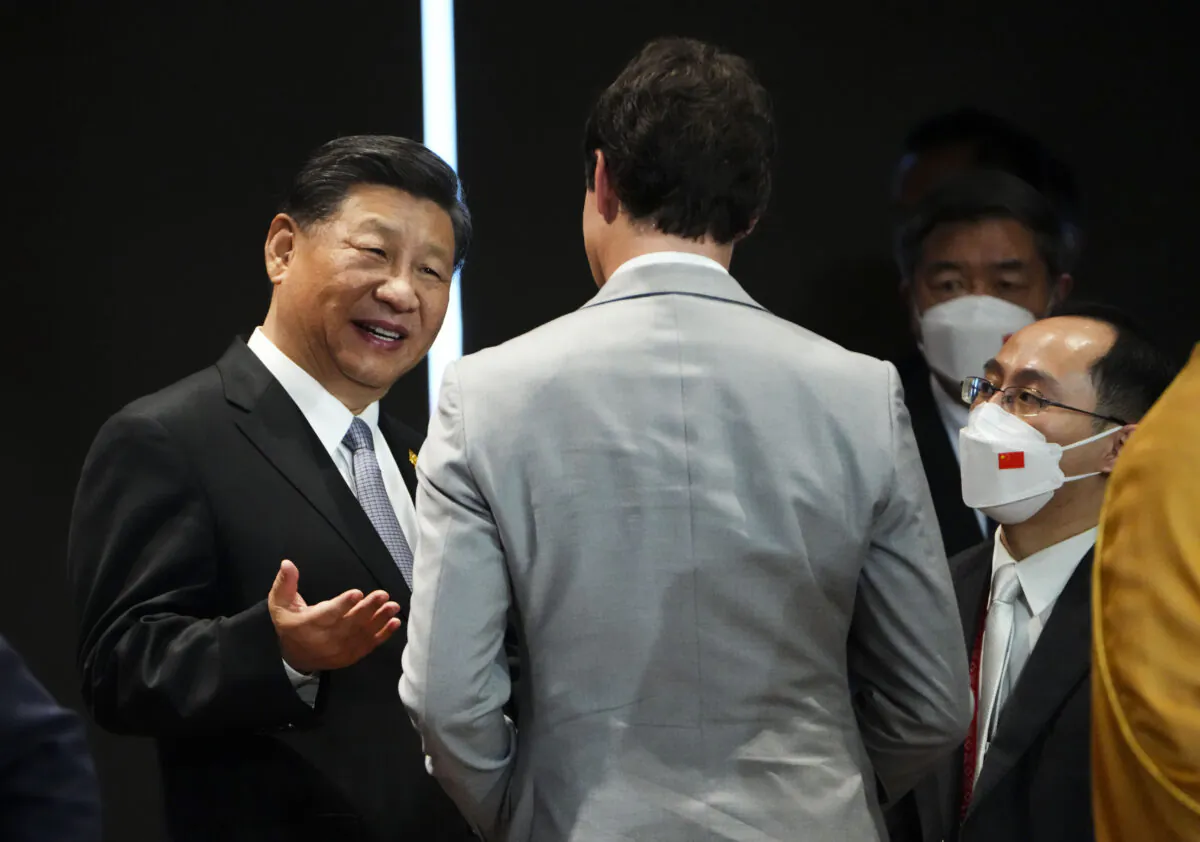 Prime Minister Justin Trudeau talks with Chinese leader Xi Jinping after taking part in the closing session at the G20 Leaders Summit in Bali, Indonesia on Nov. 16, 2022. (The Canadian Press/Sean Kilpatrick)