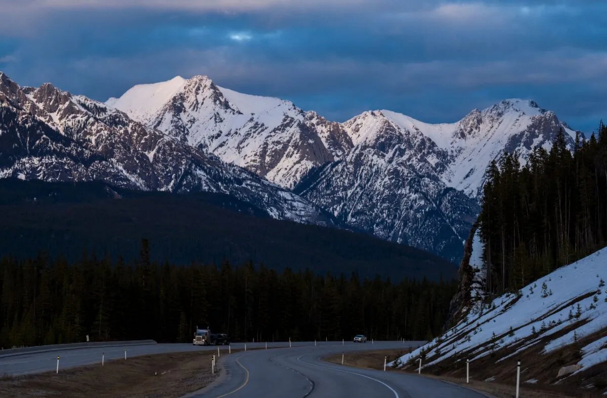 A truck travels along the Trans-Canada Highway at dusk in Banff National Park in Alberta on April 21, 2017. (Robyn Beck/AFP via Getty Images)
