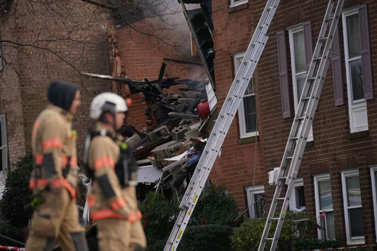 Firefighters inspect the site of a fire caused by an explosion at a Gaithersburg, Md., on Nov. 16, 2022. (Stefani Reynolds/AFP via Getty Images)