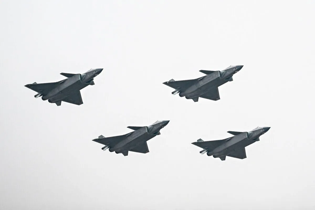 Chinese J-20 stealth fighters of the People's Liberation Army perform at the Airshow China 2022 in Zhuhai in Guangdong Province, China, on Nov. 8, 2022. (CNS/AFP via Getty Images)