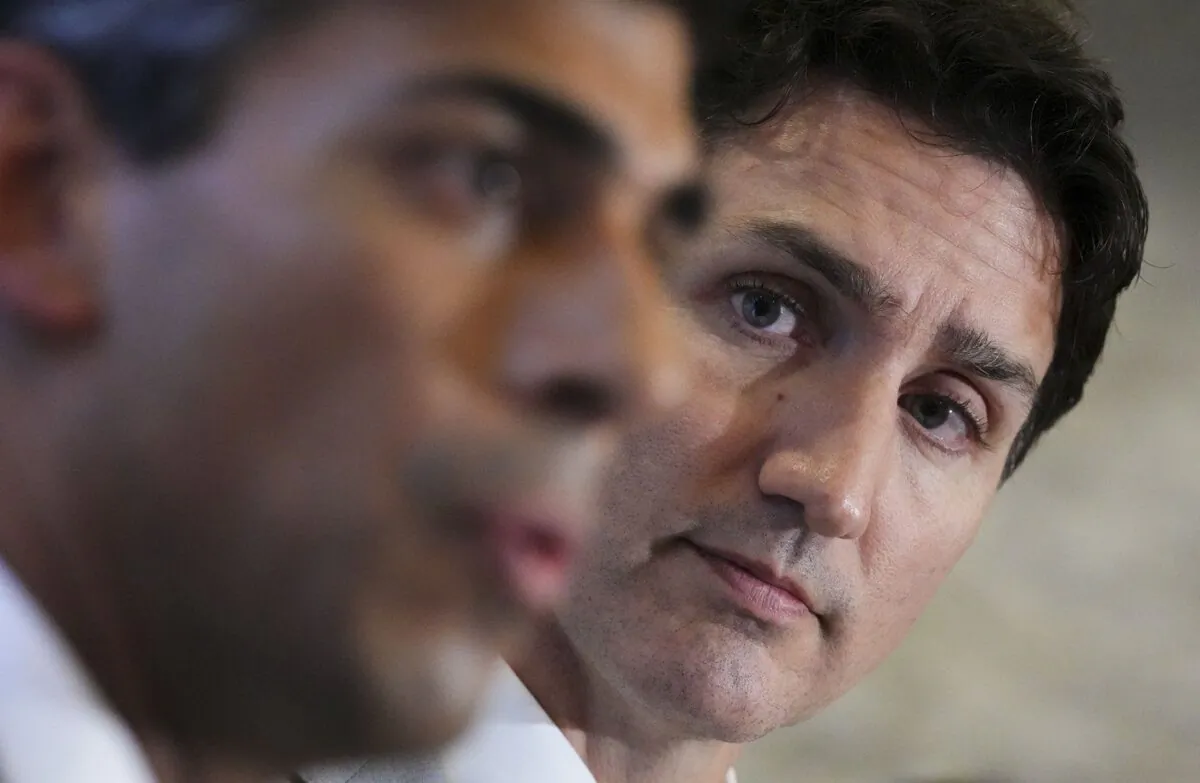Prime Minister Justin Trudeau and Britain's Prime Minister Rishi Sunak deliver a joint statement and take questions on the sidelines of the G20 Leaders Summit in Bali, Indonesia on Nov. 16, 2022. (The Canadian Press/Sean Kilpatrick)