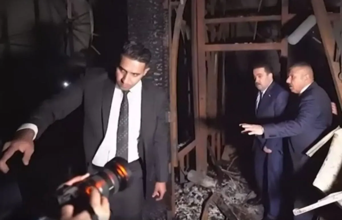 Iraqi Prime Minister Muhammad Shia al-Sudani and Interior Minister Abdul Amir al-Shammari inspect the ground floor of Baghdad's international airport's VIP hall where a fire started in Baghdad on Nov. 17, 2022, in a still from video. (Iraqi Prime Minister's Media Office via AP/Screenshot via The Epoch Times)