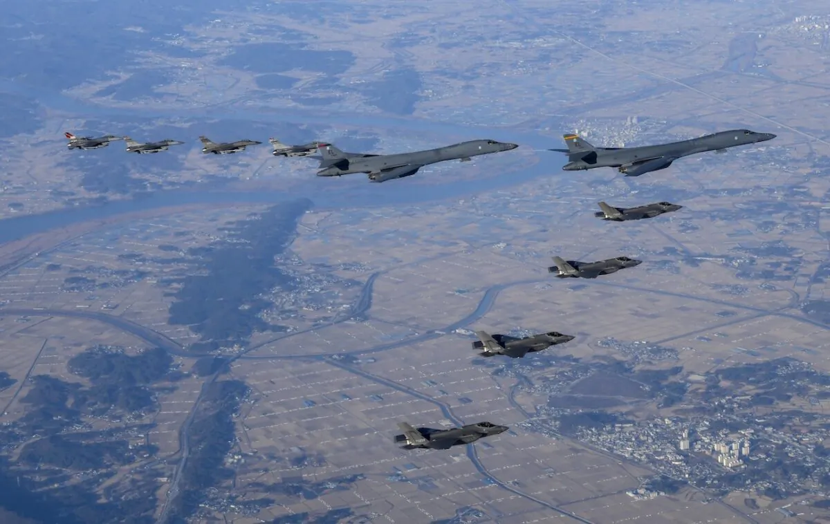 Two U.S. Air Force B-1B bombers, top center, four South Korean Air Force F-35 fighter jets and four U.S. Air Force F-16 fighter jets fly over South Korea Peninsula during a joint air drill called "Vigilant Storm," in South Korea on Nov. 5, 2022. (South Korean Defense Ministry via AP)