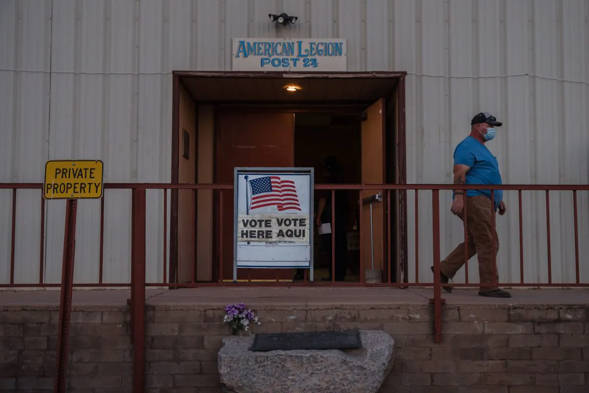 A man departs after casting a ballot in Tombstone, Ariz., on Nov. 3, 2020. (Ariana Drehsler/AFP via Getty Images)