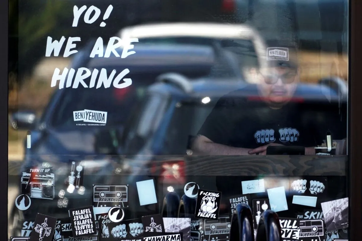 A hiring sign is displayed at a restaurant in Schaumburg, Ill., on April 1, 2022. (Nam Y. Huh/AP Photo)