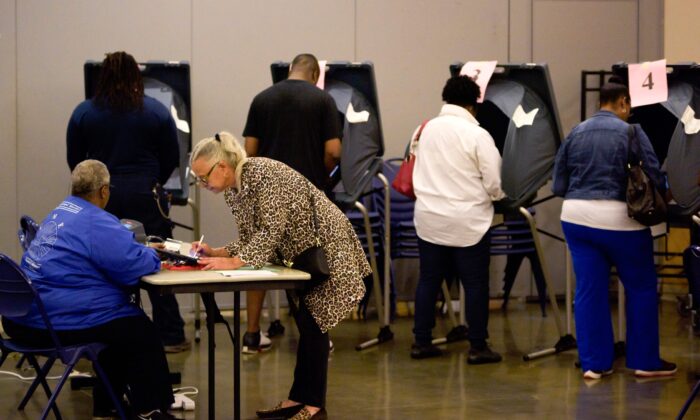 Voters cast their ballots during the Democratic presidential primary in Houston, Texas, on March 3, 2020. (MARK FELIX/AFP via Getty Images)