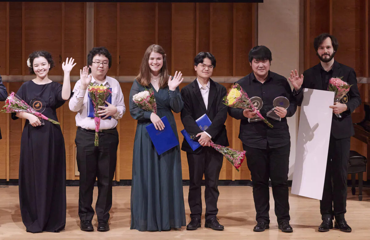 Winners of NTD's 6th International Piano Competition pose for a photo at the Merkin Concert Hall of the Kaufman Music Center in New York on Nov. 2, 2022. (Wolfgang Lian/The Epoch Times)