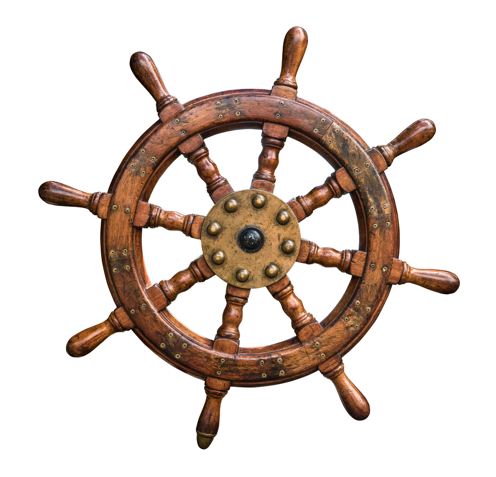 Isolated,Vintage,Wooden,And,Brass,Ship's,Steering,Wheel,With,White