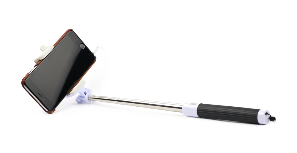 Selfie,Stick,With,The,Mounted,In,Smart,Phone,,Composition,Isolated