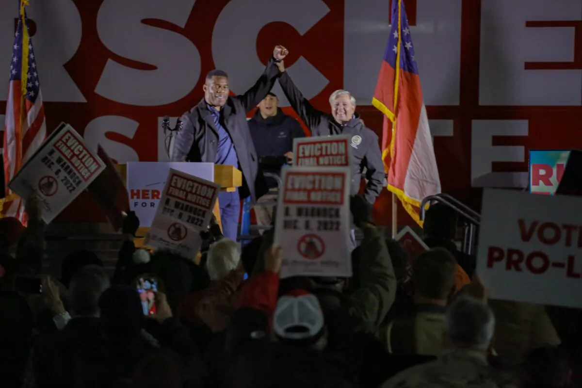 Herschel Walker (L) gets backing from Sen. Lindsey Graham (R-S.C.) in Walker's Senate runoff against Raphael Warnock. The two spoke in Gainesville, Ga., on Nov. 17, 2022. (Photo courtesy of Justin Kase Photography.)
