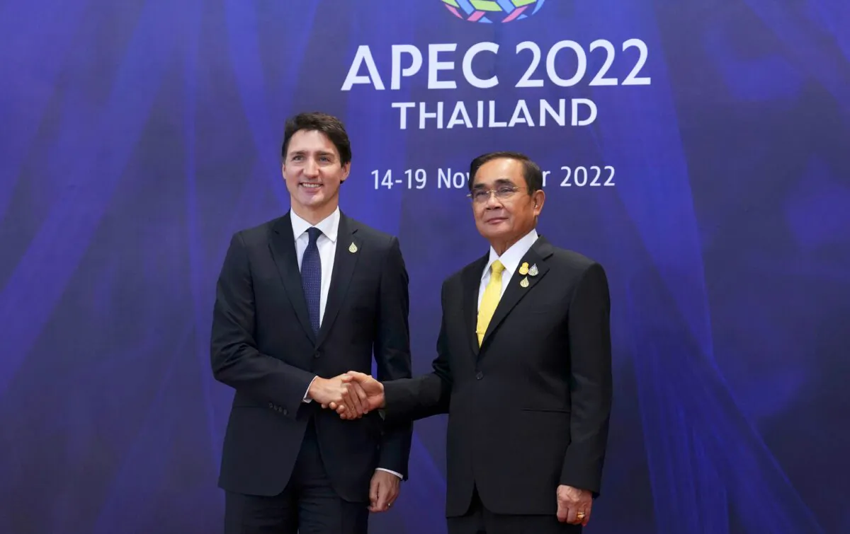 Prime Minister Justin Trudeau is greeted by Prime Minister of Thailand Prayut Chan-o-cha as he arrives for the APEC summit in Bangkok on Nov. 18, 2022. (The Canadian Press/Sean Kilpatrick)