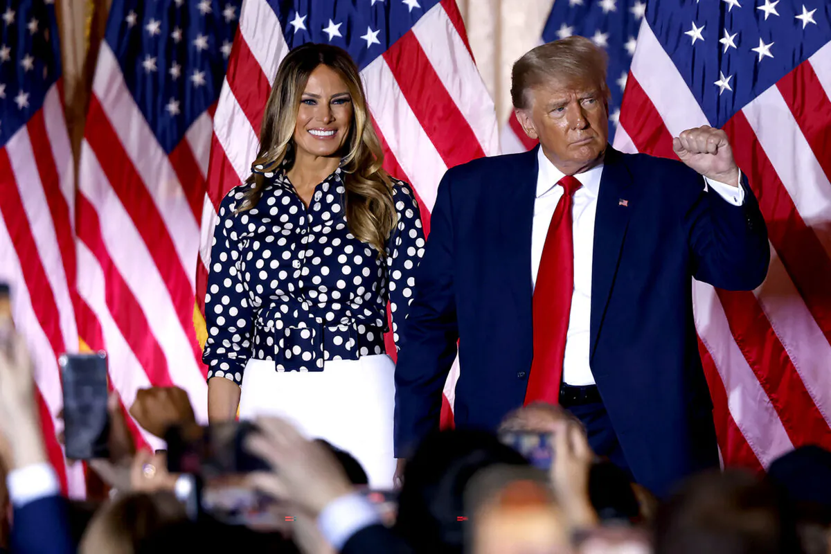Former U.S. President Donald Trump, joined by former U.S. First Lady Melania Trump, arrives to speak at the Mar-a-Lago Club in Palm Beach, Florida, on Nov. 15, 2022. (Alon Skuy/AFP via Getty Images)