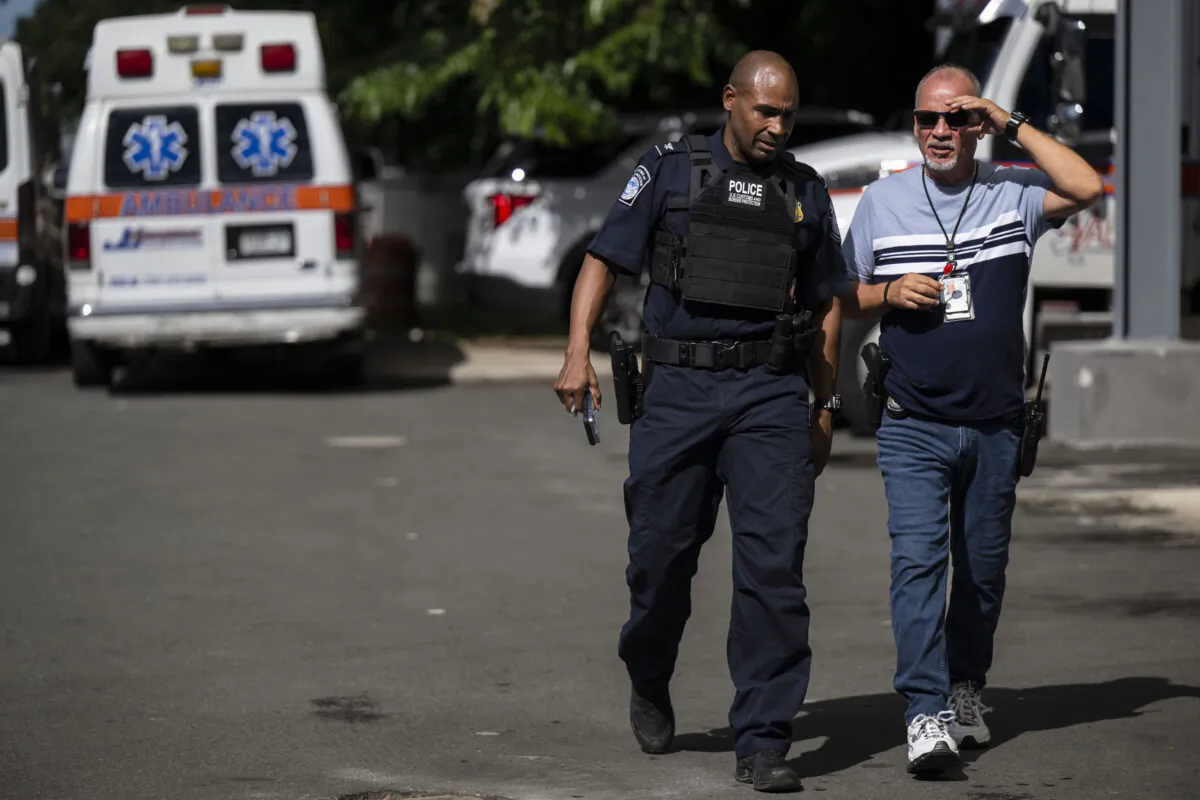 Federal agents wait for news of their injured colleagues outside the Rio Piedras Medical Center in San Juan, Puerto Rico, on Nov. 17, 2022. (Courtesy of Carlos Giusti/GFR Media via AP)