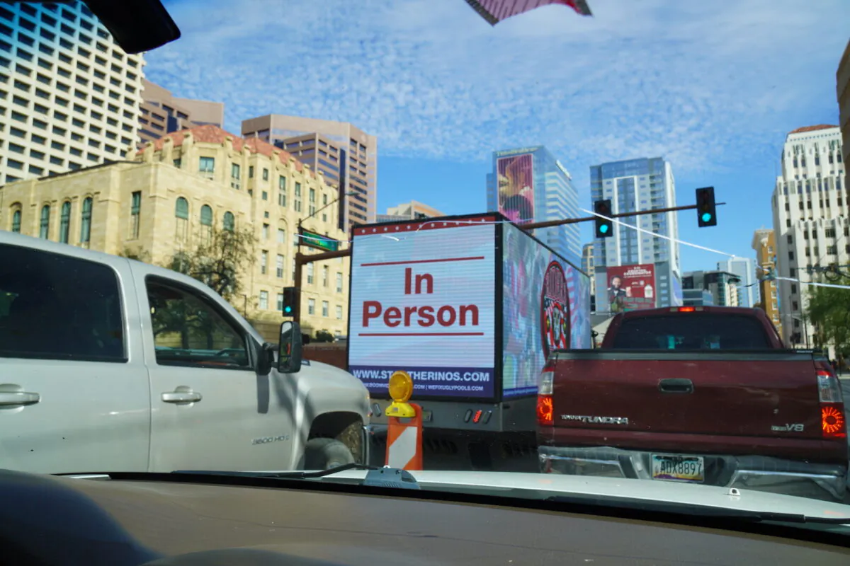 An electric billboard truck calls for a new election during a grassroots vehicle rally in Phoenix, Ariz., on Nov. 18, 2022. (Allan Stein/The Epoch Times)