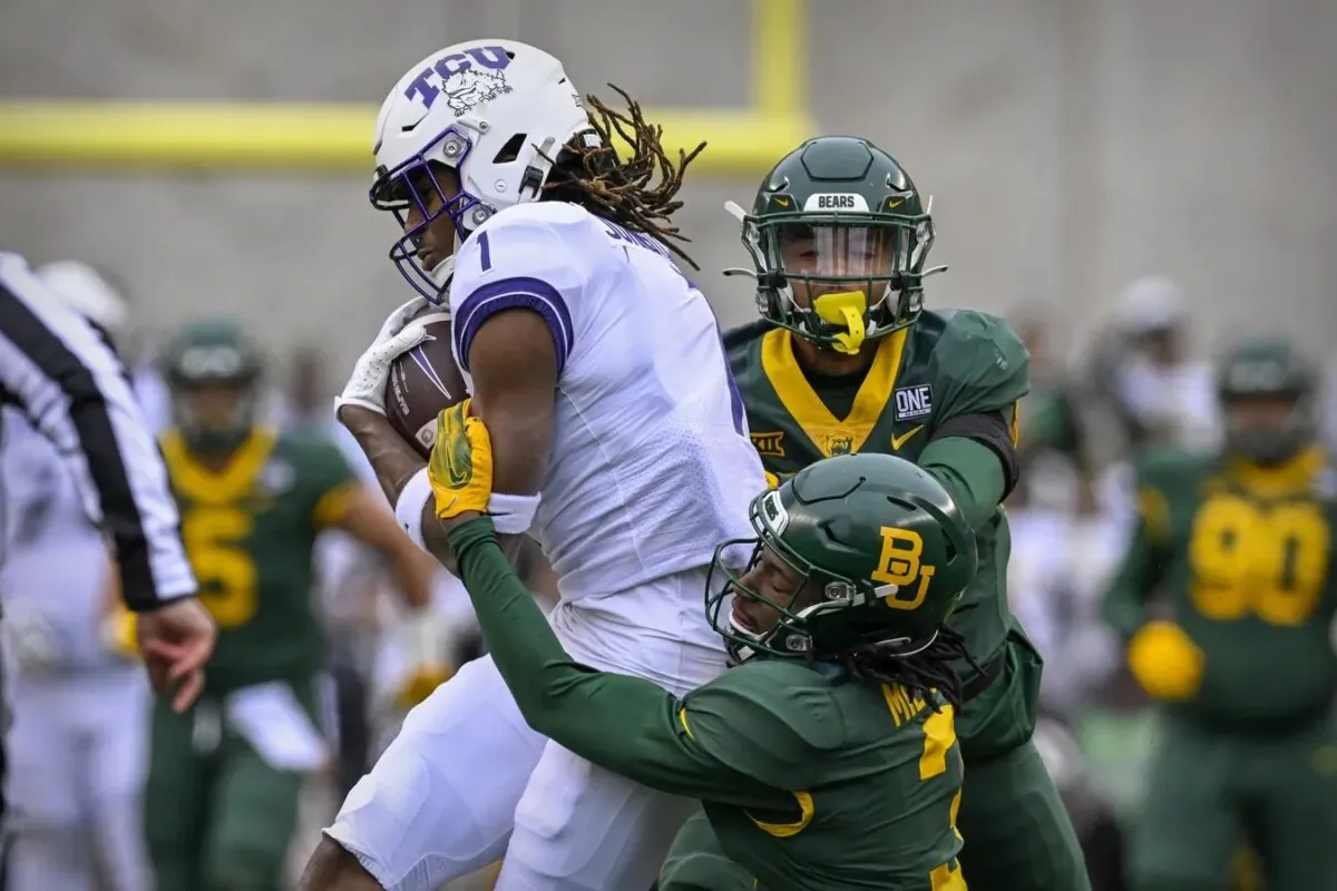 TCU Horned Frogs wide receiver Quentin Johnston (1) catches a pass for a first down against the Baylor Bears as cornerback Mark Milton (3) defends during the first quarter at McLane Stadium, Waco, Texas, on Nov. 19, 2022. (Jerome Miron/USA TODAY Sports via Field Media)